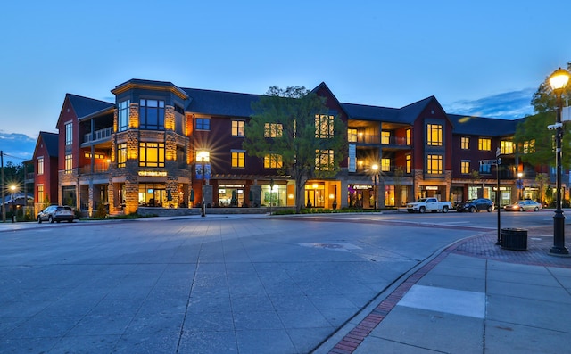 view of outdoor building at dusk