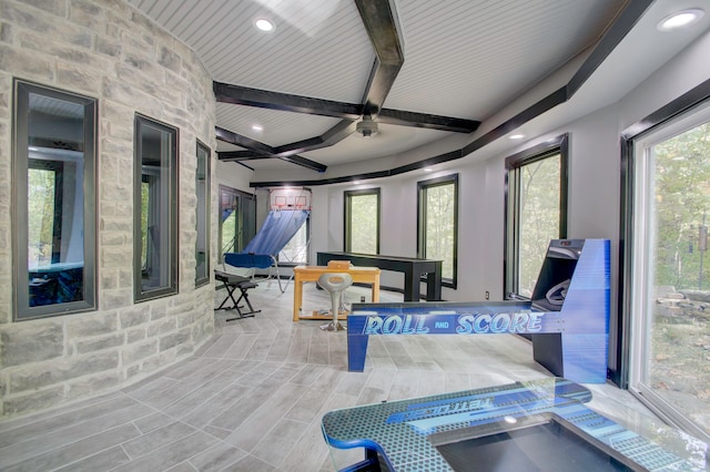 sunroom with wooden ceiling, ceiling fan, and beam ceiling