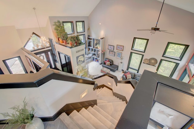 interior space featuring high vaulted ceiling, ceiling fan, and plenty of natural light