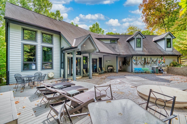 exterior space with a patio area and a deck