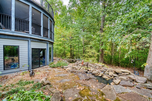 view of yard with a sunroom