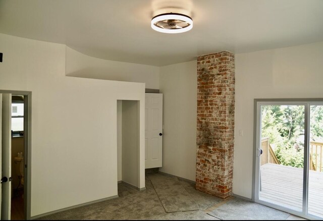 empty room with brick wall and ornate columns