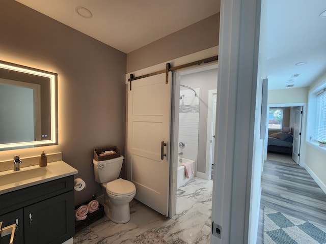 full bathroom with connected bathroom, toilet, marble finish floor, vanity, and shower / bathing tub combination