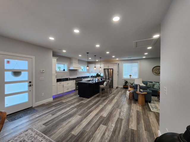 living room with sink and hardwood / wood-style flooring