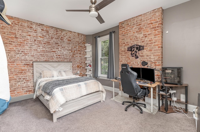 bedroom with brick wall, carpet, and ceiling fan