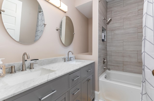 bathroom with tiled shower / bath combo and dual bowl vanity