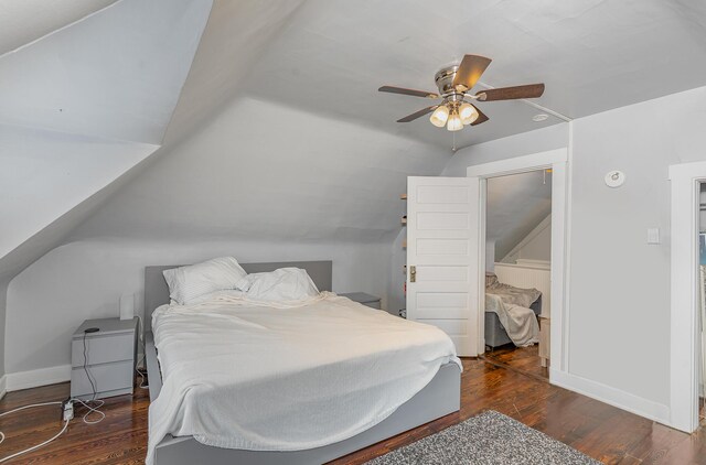 bedroom with ceiling fan, dark hardwood / wood-style flooring, and lofted ceiling