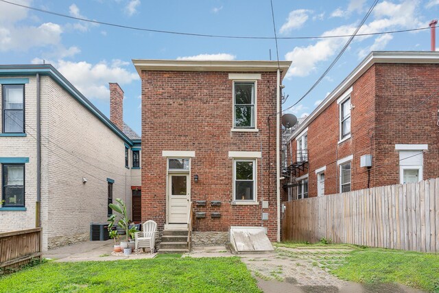 back of house with cooling unit