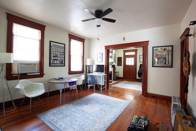 entryway featuring cooling unit, baseboards, ceiling fan, and hardwood / wood-style floors