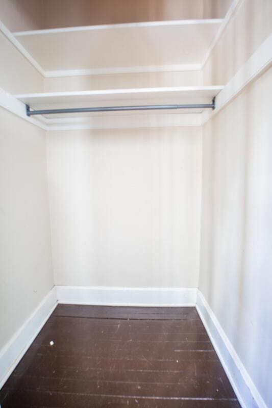 spacious closet featuring hardwood / wood-style floors