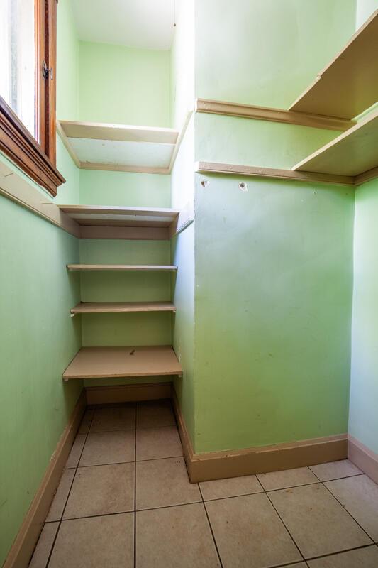 walk in closet with light tile patterned flooring