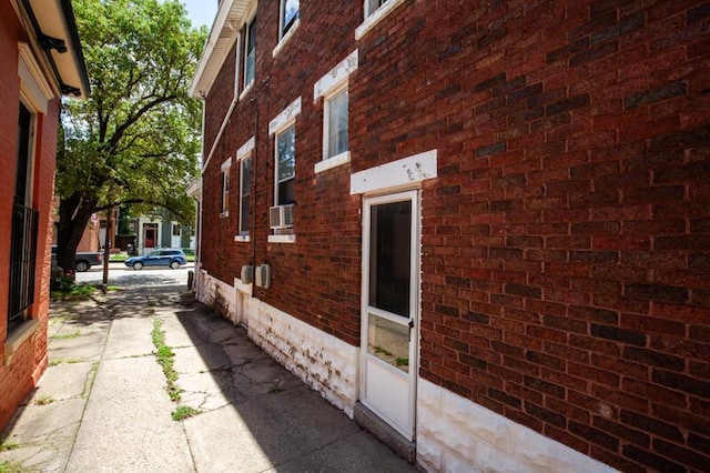 view of property exterior featuring brick siding