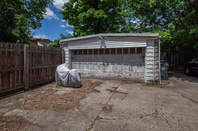 detached garage with fence