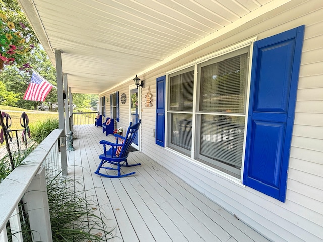 wooden deck featuring covered porch