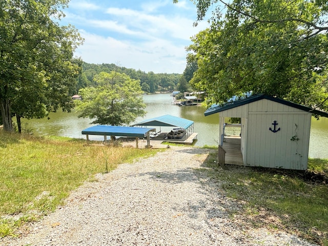 property view of water with a dock