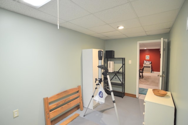 workout area with a drop ceiling