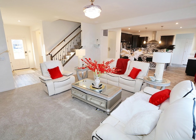 909 Riesling Ct, Walton, KY 41094 - living room with recessed lighting, stairs, and light colored carpet