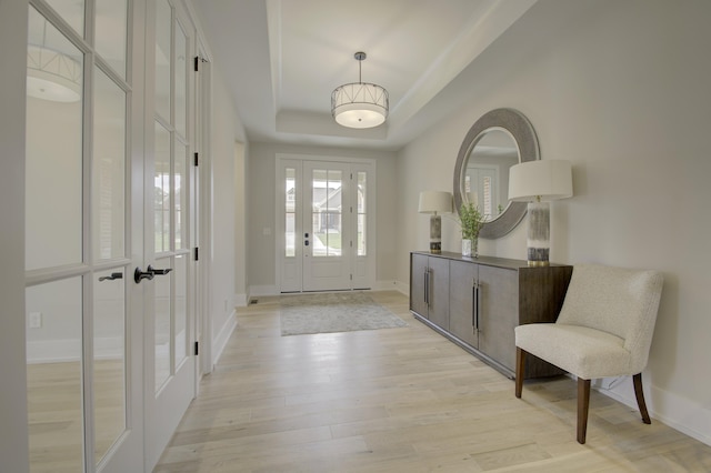 828 Fairbanks Ln, Southgate, KY 41071 - foyer entrance featuring a raised ceiling, baseboards, and light wood finished floors
