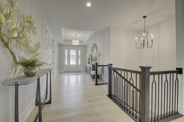 828 Fairbanks Ln, Southgate, KY 41071 - entryway featuring recessed lighting, baseboards, a chandelier, a raised ceiling, and light wood-style flooring