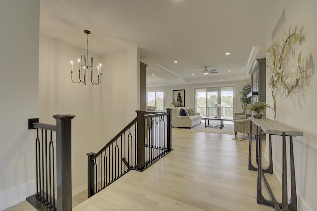 828 Fairbanks Ln, Southgate, KY 41071 - hall featuring an upstairs landing, recessed lighting, baseboards, light wood-style flooring, and a notable chandelier