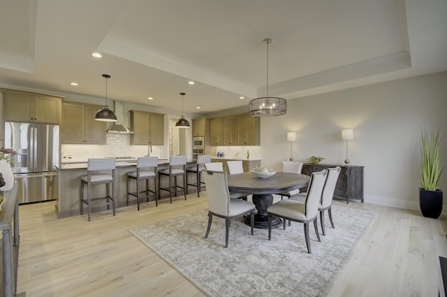 828 Fairbanks Ln, Southgate, KY 41071 - dining space with a raised ceiling, baseboards, light wood-style flooring, and recessed lighting