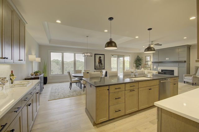 828 Fairbanks Ln, Southgate, KY 41071 - kitchen featuring a tray ceiling, plenty of natural light, and a sink
