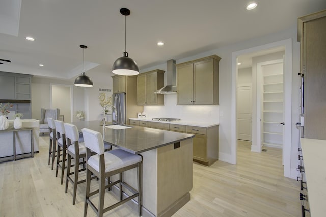 828 Fairbanks Ln, Southgate, KY 41071 - kitchen featuring wall chimney exhaust hood, recessed lighting, stainless steel appliances, a sink, and light wood-style floors