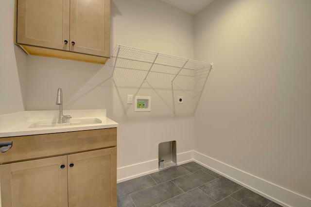 clothes washing area featuring washer hookup, dark tile patterned flooring, hookup for an electric dryer, cabinets, and sink