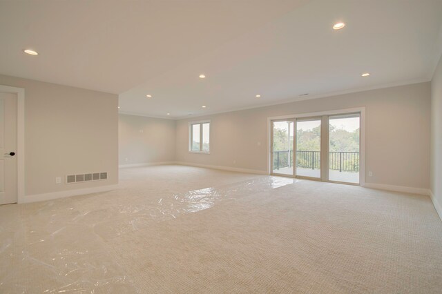 carpeted empty room with crown molding