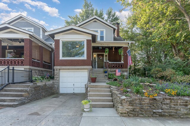 view of front facade with a porch and a garage