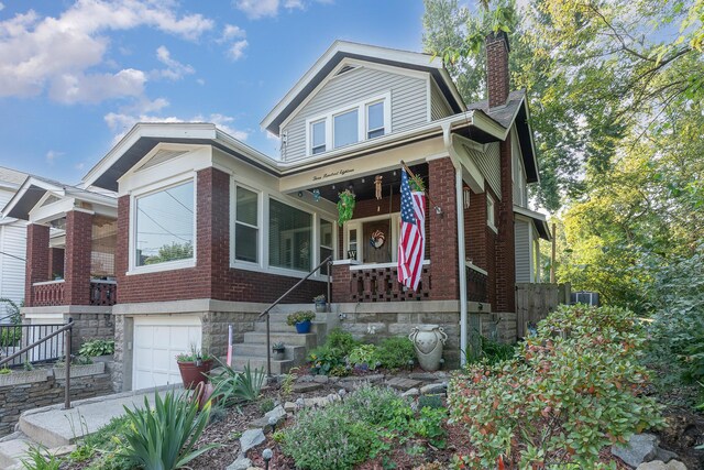 view of front facade with a porch and a garage