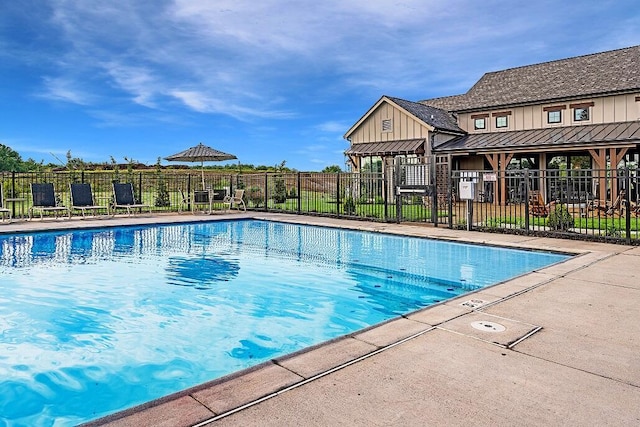 view of swimming pool with a patio area