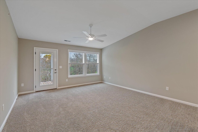 empty room featuring light colored carpet and ceiling fan