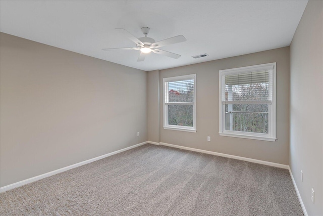 spare room with ceiling fan and carpet flooring