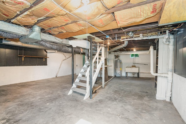 basement with water heater and sink