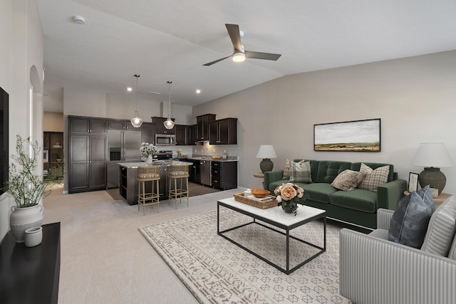 living room featuring lofted ceiling, light carpet, and ceiling fan