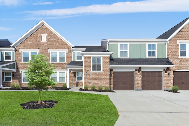 view of front of house featuring a garage and a front yard