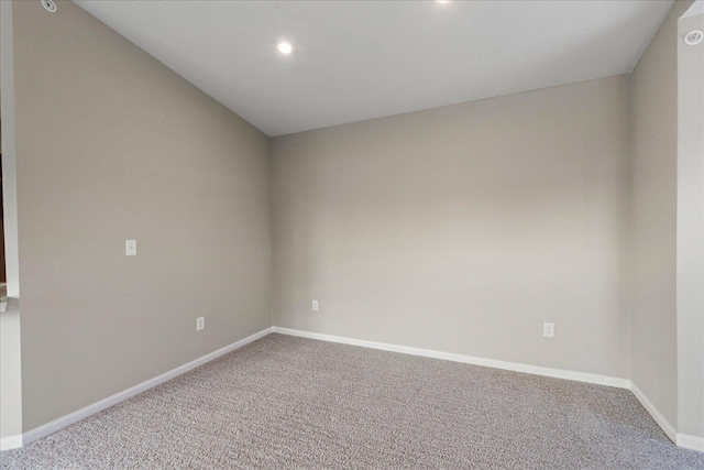 unfurnished room featuring carpet flooring