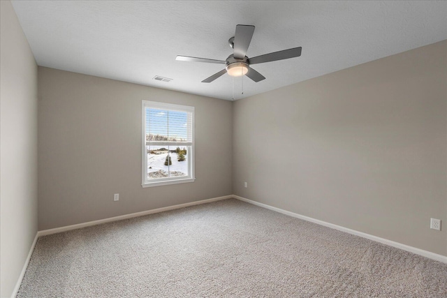 unfurnished room with carpet floors, a textured ceiling, and ceiling fan