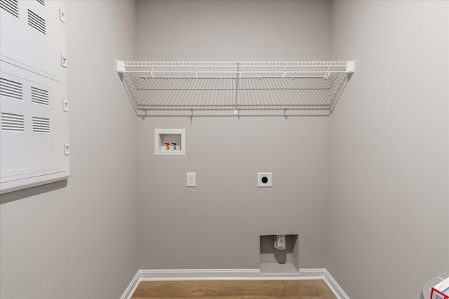 laundry area featuring hardwood / wood-style floors, electric dryer hookup, and washer hookup