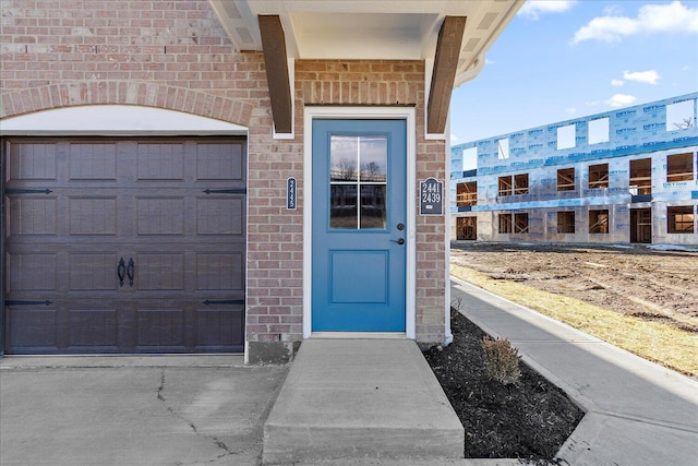 view of exterior entry with a garage