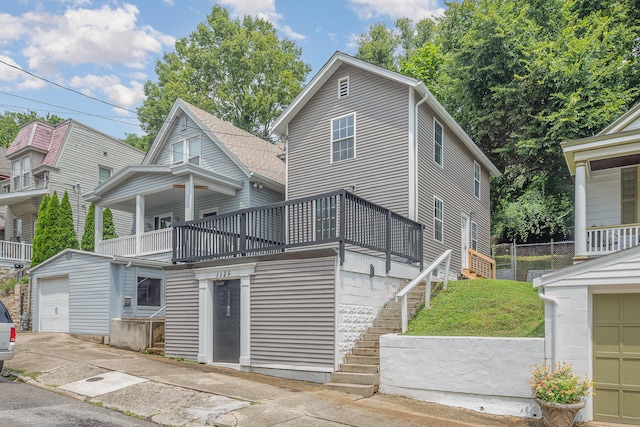 view of front of house with a balcony and a garage