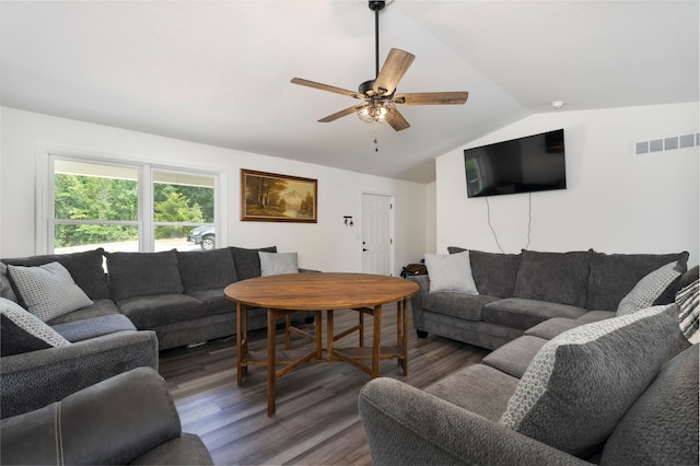 living room with ceiling fan, dark wood-type flooring, and lofted ceiling