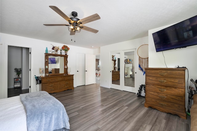 bedroom with hardwood / wood-style flooring, french doors, and ceiling fan