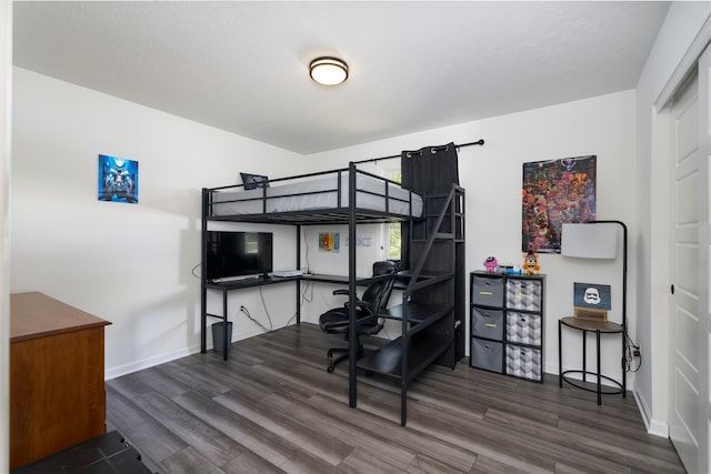 bedroom featuring dark hardwood / wood-style flooring