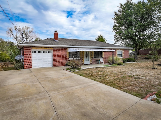 ranch-style home featuring a front yard, a porch, and a garage