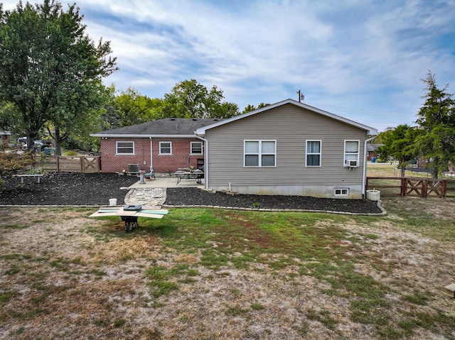 back of house featuring a yard and a patio area