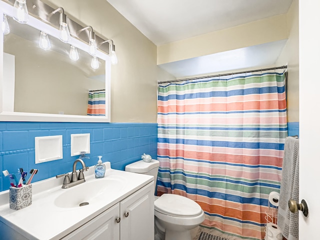 bathroom featuring tile walls, curtained shower, vanity, and toilet