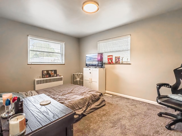 carpeted bedroom featuring radiator heating unit