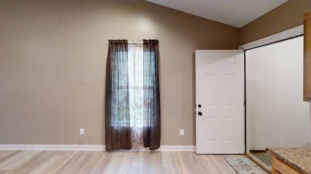 304 Brentwood Dr, Dry Ridge, KY 41035 - foyer featuring light wood-type flooring, lofted ceiling, and baseboards